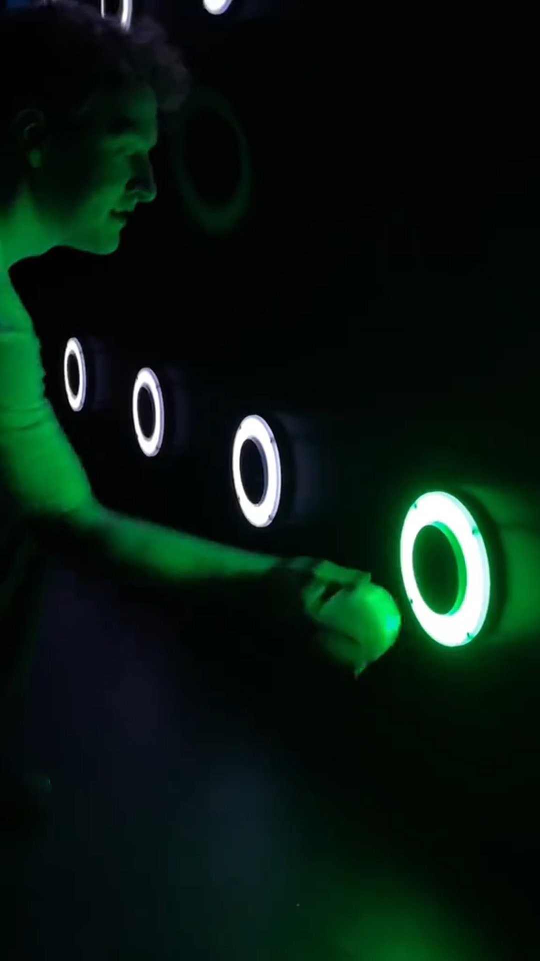 A player places a ball into a lighted tube