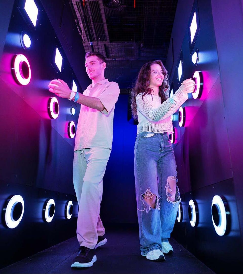 Two players are throwing balls into the pipe ball