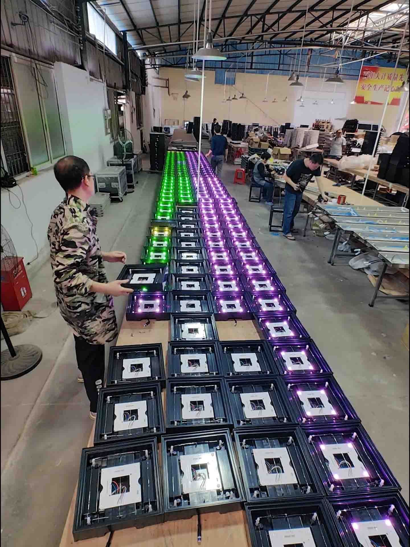 Workers assemble the mega grid in the workshop