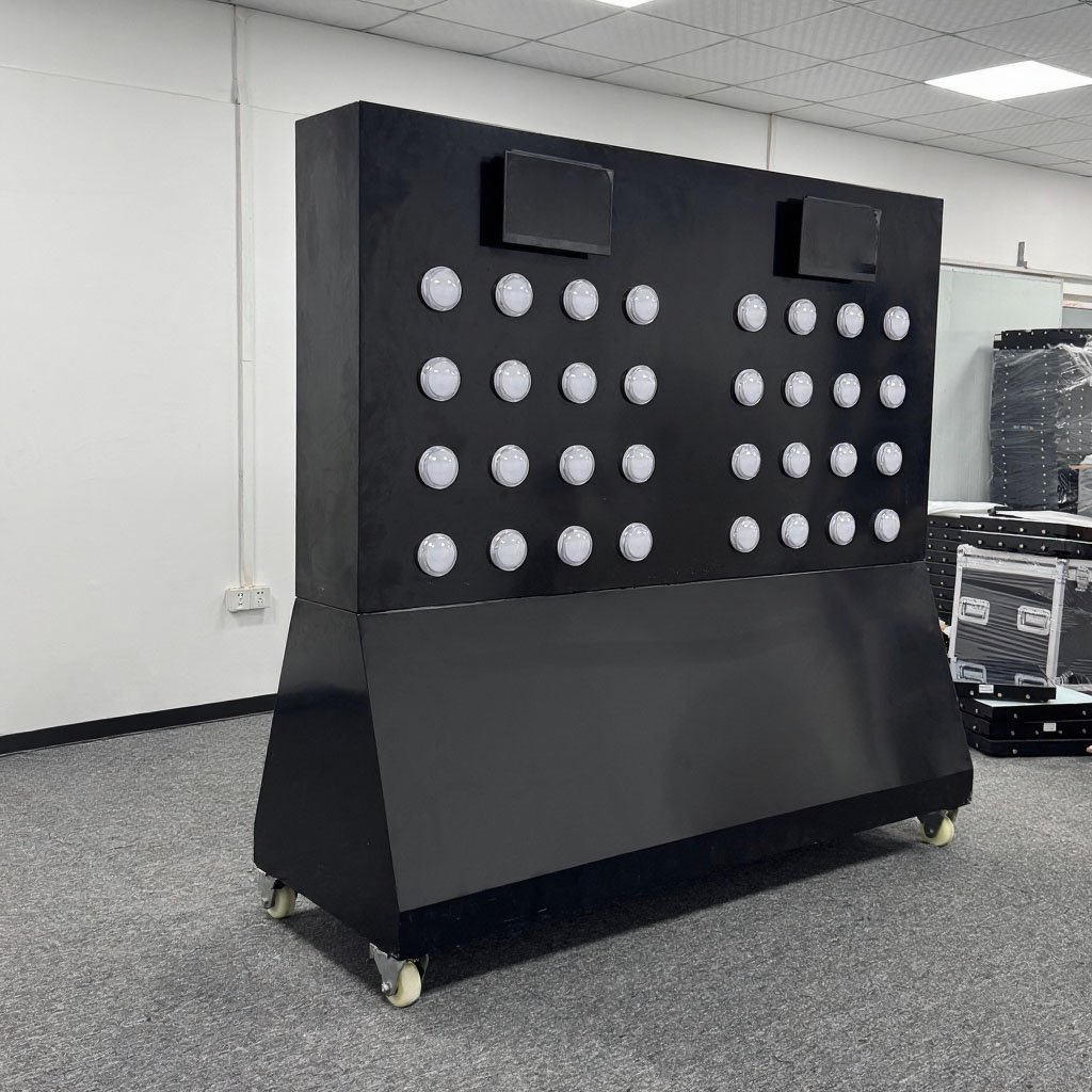 Black freestanding sensing sports wall on wheels with unlit white circular buttons and two top screens.